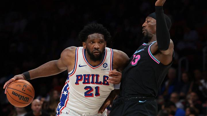 Mar 30, 2026; Miami, Florida, USA; Philadelphia 76ers center Joel Embiid (21) drives to the basket against Miami Heat center Bam Adebayo (13) during the third quarter at Kaseya Center. Mandatory Credit: Sam Navarro-Imagn Images