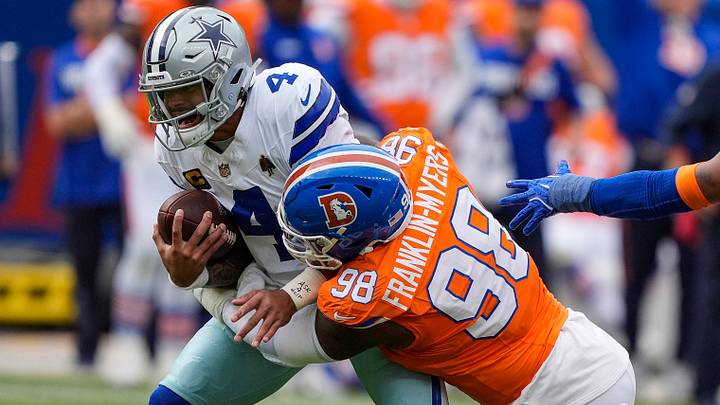 October 26, 2025: Dallas Cowboys quarterback Dak Prescott (4) is sacked by Denver Broncos defensive end John Franklin-Myers (98) win the first half of the football game between the Denver Broncos and Dallas Cowboys. 
