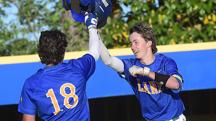 Laney’s #8 Owen Gore celebrates with his team after hitting a homerun as Laney played New Hanover in baseball April 28, 2026.