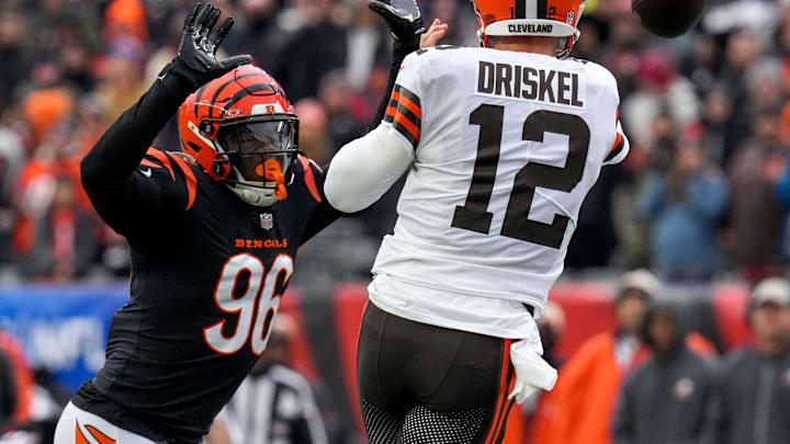 Cincinnati Bengals defensive end Cam Sample (96) rushes Cleveland Browns quarterback Jeff Driskel (12) in the first quarter of the NFL Week 18 game between the Cincinnati Bengals and the Cleveland Browns at Paycor Stadium in downtown Cincinnati on Sunday, Jan. 7, 2024. Cincinnati Bengals defensive end Cam Sample (96) rushes Cleveland Browns quarterback Jeff Driskel (12) in the first quarter of the NFL Week 18 game between the Cincinnati Bengals and the Cleveland Browns at Paycor Stadium in downtown Cincinnati on Sunday, Jan. 7, 2024.