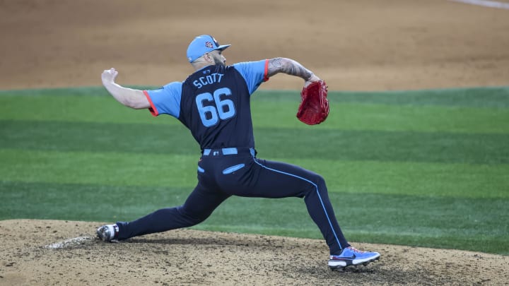 Jul 16, 2024; Arlington, Texas, USA; National League pitcher Tanner Scott of the Miami Marlins (66) pitches in the eight inning during the 2024 MLB All-Star game at Globe Life Field. Mandatory Credit: Tim Heitman-USA TODAY Sports