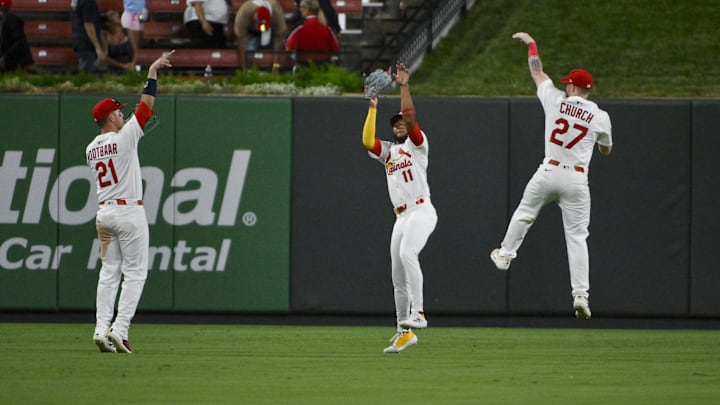 Sep 2, 2025; St. Louis, Missouri, USA; St. Louis Cardinals outfielder Lars Nootbaar (21) center fielder Victor Scott II (11) and right fielder Nathan Church (27) celebrate after the Cardinals defeated the Athletics at Busch Stadium. Mandatory Credit: Jeff Curry-Imagn Images Sep 2, 2025; St. Louis, Missouri, USA; St. Louis Cardinals outfielder Lars Nootbaar (21) center fielder Victor Scott II (11) and right fielder Nathan Church (27) celebrate after the Cardinals defeated the Athletics at Busch Stadium. Mandatory Credit: Jeff Curry-Imagn Images
