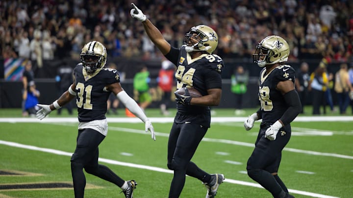 New Orleans Saints DE Cameron Jordan reacts to intercepting the pass of Tampa Bay Buccaneers QB Baker Mayfield.