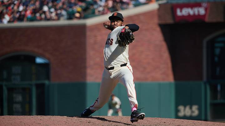May 10, 2026; San Francisco, California, USA; San Francisco Giants pitcher Dylan Smith (66) throws a pitch against the Pittsburgh Pirates during the eleventh inning at Oracle Park. Mandatory Credit: Robert Edwards-Imagn Images