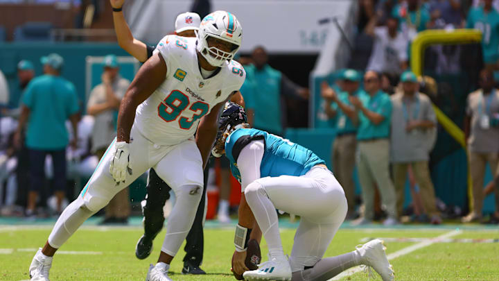 Sep 8, 2024; Miami Gardens, Florida, USA; Miami Dolphins defensive tackle Calais Campbell (93) celebrates after sacking Jacksonville Jaguars quarterback Trevor Lawrence (16) during the first quarter at Hard Rock Stadium.