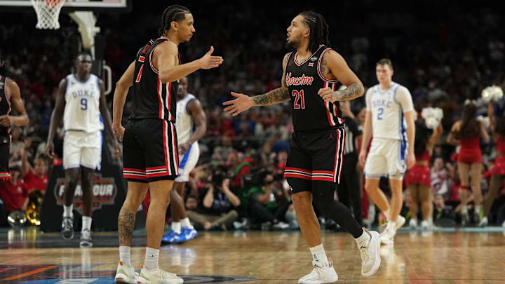 Houston Cougars guard Milos Uzan (7) high fives guard Emanuel Sharp (21) after a play against the Duke Blue Devils during the second half in the semifinals of the men's Final Four.