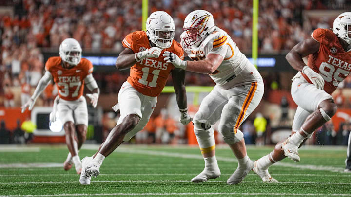 Sep 21, 2024; Austin, Texas, USA;  Texas Longhorns linebacker Colin Simmons (11) rushes in against Louisiana Monroe Warhawks offensive tackle Sam Carson (60) in the second half at Darrell K Royal-Texas Memorial Stadium. Mandatory Credit: Daniel Dunn-Imagn Images