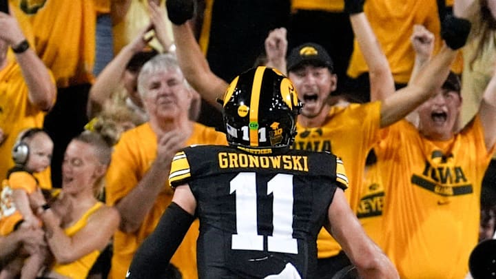 Iowa Hawkeyes quarterback Mark Gronowski (11) scores a rushing touchdown against the Massachusetts Minutemen in the second quarter Sept. 13, 2025 at Kinnick Stadium in Iowa City, Iowa. Iowa Hawkeyes quarterback Mark Gronowski (11) scores a rushing touchdown against the Massachusetts Minutemen in the second quarter Sept. 13, 2025 at Kinnick Stadium in Iowa City, Iowa.