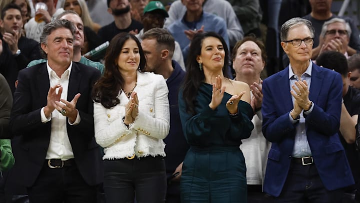 Oct 27, 2023; Boston, Massachusetts, USA; Boston Celtics owner Wyc Grousbeck (left) and his wife Emilia Fazzalari applaud with Boston Red Sox owner John Henry (right) and his wife Linda Pizzuti Henry during the second quarter of the game between the Boston Celtics and the Miami Heat at TD Garden. Mandatory Credit: Winslow Townson-Imagn Images