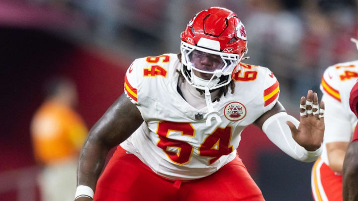 Aug 9, 2025; Glendale, Arizona, USA; Kansas City Chiefs offensive tackle Wanya Morris (64) against the Arizona Cardinals during a preseason NFL game at State Farm Stadium. Mandatory Credit: Mark J. Rebilas-Imagn Images