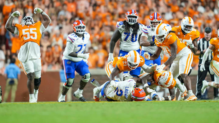 Tennessee defensive lineman James Pearce Jr. (27) and Tennessee defensive back Boo Carter (23) tackle Florida quarterback DJ Lagway (2)during a NCAA football game between Tennessee and Florida in Neyland Stadium, in Knoxville, Tenn., Oct. 12, 2024.