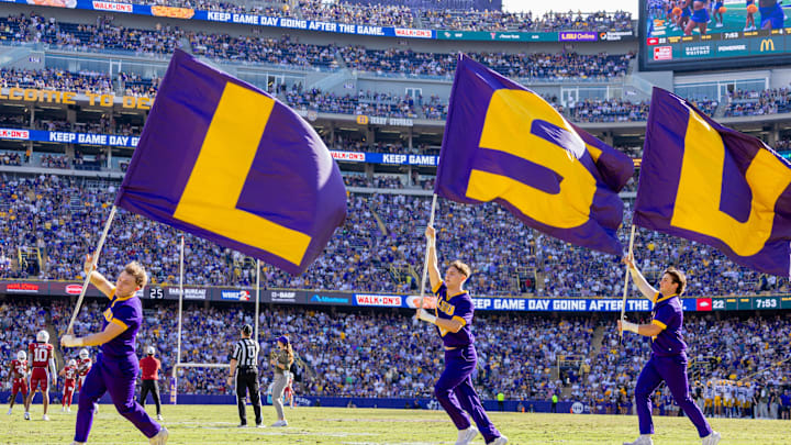 Nov 15, 2025; Baton Rouge, Louisiana, USA; LSU Tigers cheerleaders react to a touchdown against the Arkansas Razorbacks during the second half at Tiger Stadium. Mandatory Credit: Stephen Lew-Imagn Images Nov 15, 2025; Baton Rouge, Louisiana, USA; LSU Tigers cheerleaders react to a touchdown against the Arkansas Razorbacks during the second half at Tiger Stadium. Mandatory Credit: Stephen Lew-Imagn Images