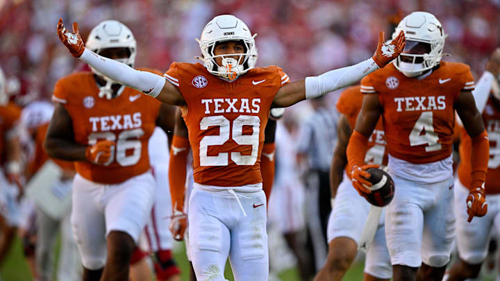 Oct 11, 2025; Dallas, Texas, USA; Texas Longhorns defensive back Graceson Littleton (29) celebrates after he intercepts a pass from Oklahoma Sooners quarterback John Mateer (not pictured) during the second half at the Cotton Bowl. Mandatory Credit: Jerome Miron-Imagn Images