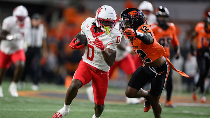 Sep 26, 2025; Corvallis, Oregon, USA; Houston Cougars wide receiver Amare Thomas (0) runs the ball during the fourth quarter against the Oregon State Beavers at Reser Stadium. Mandatory Credit: Craig Strobeck-Imagn Images