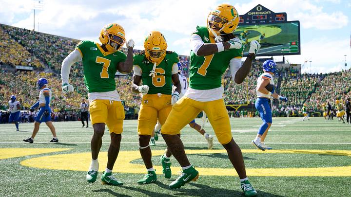Sep 5, 2026; Eugene, Oregon, USA; Oregon Ducks wide receiver Dakorien Moore (1) celebrates with wide receiver Evan Stewart (7) and running back Dierre Hill Jr. (6) after scoring a touchdown during the second half against the Boise State Broncos at Autzen Stadium. Mandatory Credit: Troy Wayrynen-Imagn Images