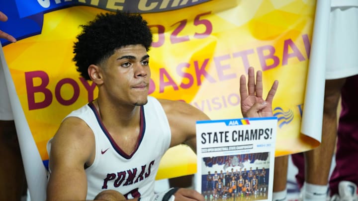 Perry forward Koa Peat holds up a four representing his fourth championship after winning the Boys Open State Championship game over Sunnyslope at Veterans Memorial Coliseum in Phoenix on March 8, 2025.