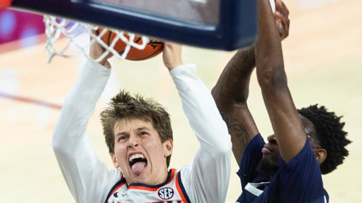 Auburn Tigers guard Blake Muschalek (21) draws a foul as he goes up for a layup as Auburn Tigers take on Jackson State Tigers at Neville Arena in Auburn, Ala. on Wednesday, Nov. 19, 2025. Auburn Tigers lead Jackson State Tigers 55-24 at halftime.