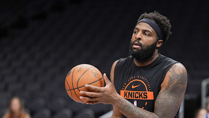 Mar 26, 2026; Charlotte, North Carolina, USA; New York Knicks center/forward Mitchell Robinson (23) shoots during pregame warm ups against the Charlotte Hornets at the Spectrum Center. Mandatory Credit: Jim Dedmon-Imagn Images