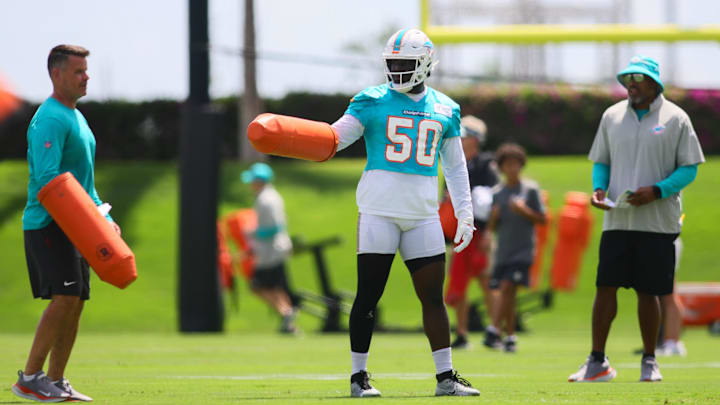 Former Miami Dolphins linebacker Mohamed Kamara (50) works out during mandatory minicamp at Baptist Health Training Complex.