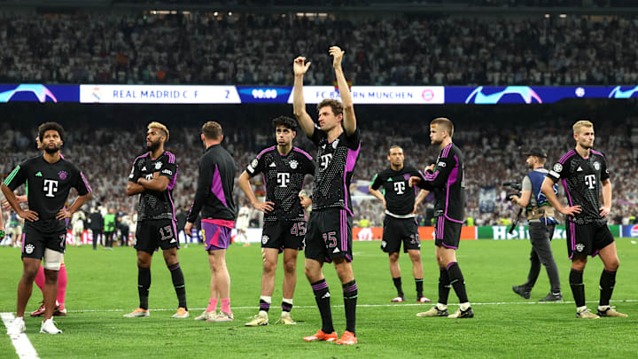 Bayern Munich players applauding fans after defeat against Real Madrid.
