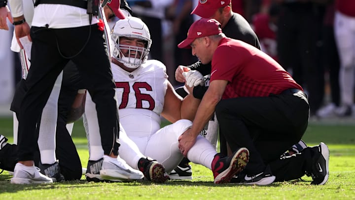 Oct 6, 2024; Santa Clara, California, USA; Arizona Cardinals guard Will Hernandez (76) is examined by medical personnel during the fourth quarter against the San Francisco 49ers at Levi's Stadium. Mandatory Credit: Darren Yamashita-Imagn Images