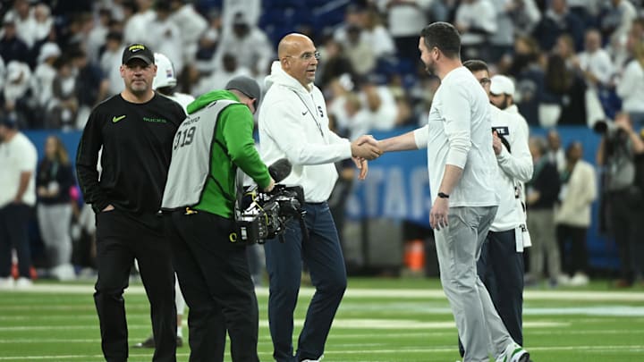 Penn State Nittany Lions head coach James Franklin shakes hands with Oregon Ducks head coach Dan Lanning in the 2024 Big Ten Championship game at Lucas Oil Stadium. 