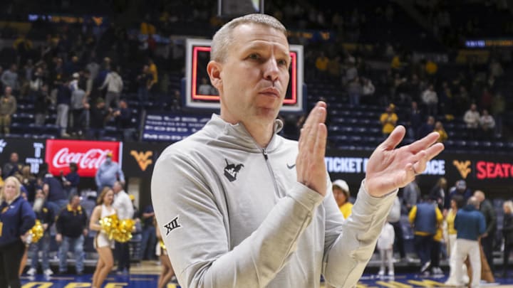 Jan 6, 2026; Morgantown, West Virginia, USA; West Virginia Mountaineers head coach Ross Hodge celebrates after defeating the Cincinnati Bearcats at Hope Coliseum. Mandatory Credit: Ben Queen-Imagn Images