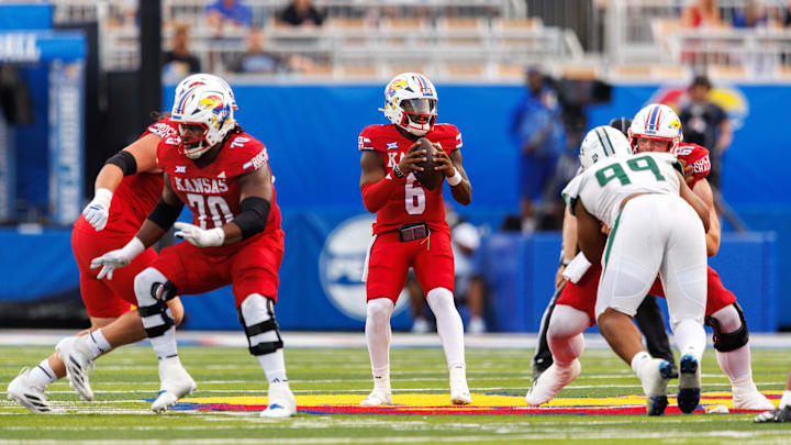 Aug 29, 2025; Lawrence, Kansas, USA; Kansas Jayhawks quarterback Jalon Daniels (6) looks to pass during the first half against the Wagner Seahawks at David Booth Kansas Memorial Stadium. Mandatory Credit: William Purnell-Imagn Images