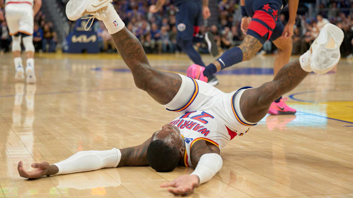 Jan 18, 2025; San Francisco, California, USA; Golden State Warriors guard Dennis Schroder (71) falls to the court against the Washington Wizards during the third quarter at Chase Center. Mandatory Credit: Robert Edwards-Imagn Images