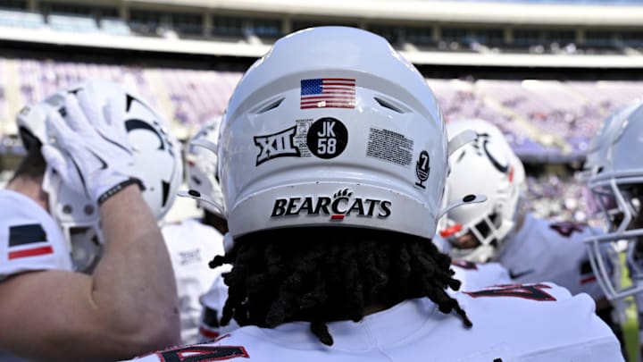 Nov 29, 2025; Fort Worth, Texas, USA; A view of the JK 58 decal on the back of the helmet of Cincinnati Bearcats defensive end Mikah Coleman (4) before the game at Amon G. Carter Stadium. Mandatory Credit: Jerome Miron-Imagn Images Nov 29, 2025; Fort Worth, Texas, USA; A view of the JK 58 decal on the back of the helmet of Cincinnati Bearcats defensive end Mikah Coleman (4) before the game at Amon G. Carter Stadium. Mandatory Credit: Jerome Miron-Imagn Images