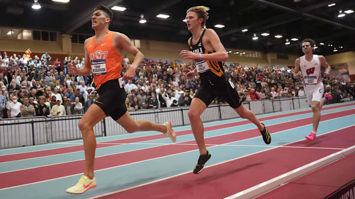 Mar 11, 2023; Albuquerque, New Mexico, USA; Fouad Messaoudi of Oklahoma State defeats Drew Bosley of Northern Arizona to win the 3,000m in 7:48.10 during the NCAA Indoor Championships at Albuquerque Convention Center. Mandatory Credit: Kirby Lee-Imagn Images