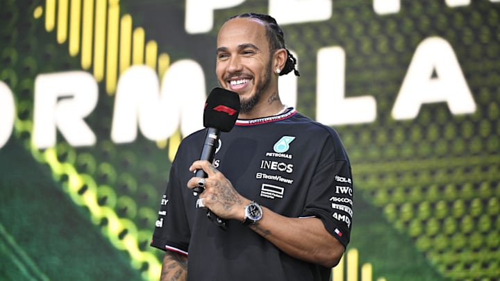 Oct 19, 2024; Austin, Texas, USA; Mercedes AMG Petronas F1 Team driver Lewis Hamilton (44) of Team Great Britain smiles to the crowd during a fan forum before the Sprint Race in the 2024 Formula One US Grand Prix at Circuit of the Americas. Mandatory Credit: Jerome Miron-Imagn Images