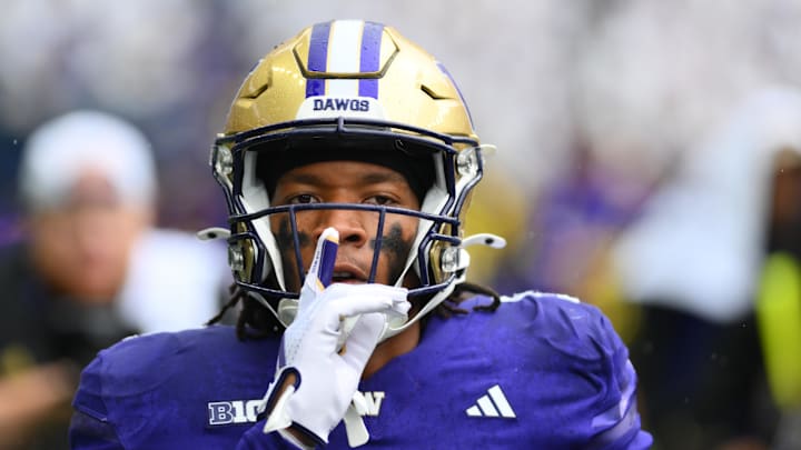 Sep 14, 2024; Seattle, Washington, USA; Washington Huskies cornerback Thaddeus Dixon (9) celebrates after intercepting a pass against the Washington State Cougars during the second half at Lumen Field. Mandatory Credit: Steven Bisig-Imagn Images