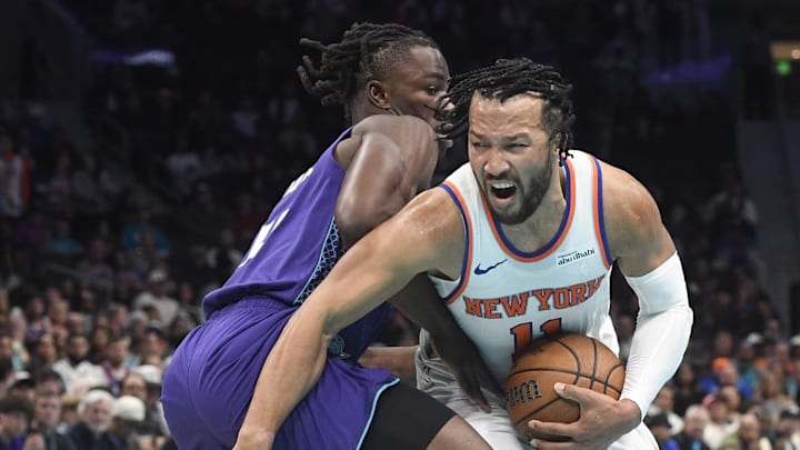 Nov 26, 2025; Charlotte, North Carolina, USA; New York Knicks guard Jalen Brunson (11) drives past Charlotte Hornets guard Collin Sexton (8) during the first half at the Spectrum Center. Mandatory Credit: Sam Sharpe-Imagn Images