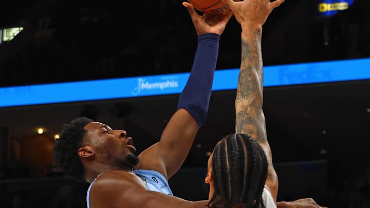 Feb 25, 2025; Memphis, Tennessee, USA; Memphis Grizzlies forward Jaren Jackson Jr. (13) shoots as Phoenix Suns center Nick Richards (2) defends during the first quarter at FedExForum. Mandatory Credit: Petre Thomas-Imagn Images