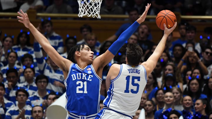 Oct 21, 2022; Durham, North Carolina, US; Duke Blue Devils center Ryan Young (15) shoots over Duke Blue Devils center Christian Reeves (21) during Countdown to Craziness at Cameron Indoor Stadium. Mandatory Credit: Rob Kinnan-Imagn Images