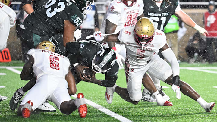 Sep 21, 2024; Chestnut Hill, Massachusetts, USA; Michigan State Spartans quarterback Aidan Chiles (2) is tackled by the Boston College Eagles during the second half at Alumni Stadium. Mandatory Credit: Eric Canha-Imagn Images