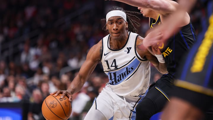 Mar 22, 2025; Atlanta, Georgia, USA; Atlanta Hawks guard Terance Mann (14) drives to the basket against the Golden State Warriors in the first quarter at State Farm Arena. Mandatory Credit: Brett Davis-Imagn Images