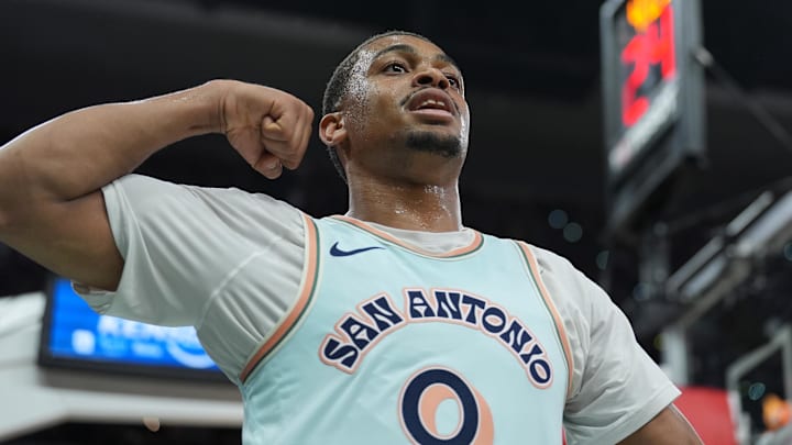 Mar 29, 2025; San Antonio, Texas, USA; San Antonio Spurs forward Keldon Johnson (0) celebrates in the first half against the Boston Celtics at Frost Bank Center. 