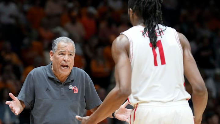 Houston Cougars head coach Kelvin Sampson speaks with forward Joseph Tugler (11)