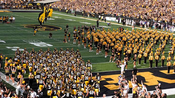 The Iowa Hawkeyes team takes the field against the Albany Great Danes during the Swarm Aug. 30, 2025 at Kinnick Stadium in Iowa City, Iowa. The Iowa Hawkeyes team takes the field against the Albany Great Danes during the Swarm Aug. 30, 2025 at Kinnick Stadium in Iowa City, Iowa.