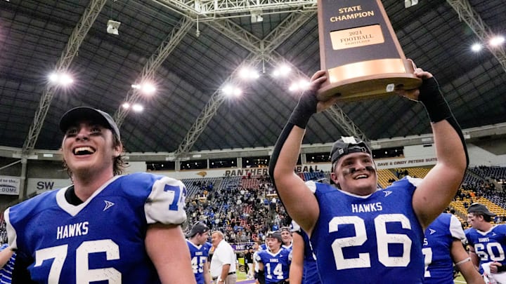 Remsen St. Mary's Lennan Steichen (76) and Remsen St. Mary's Brady Koenck (26) celebrate after defeating Gladbrook-Reinbeck during the Iowa high school 8-player championship Thursday, Nov. 21, 2024 at the UNI-Dome in Cedar Falls, Iowa.