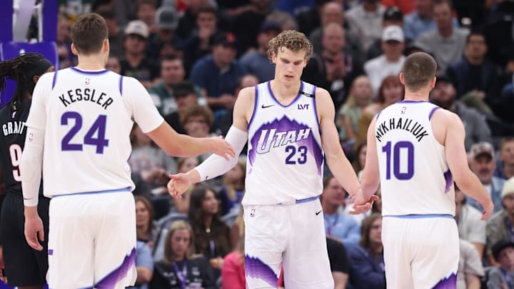 Oct 29, 2025; Salt Lake City, Utah, USA: Utah Jazz forward Lauri Markkanen (23) interacts with center Walker Kessler (24) and guard Svi Mykhailiuk (10) after a basket against the Portland Trail Blazers during the second quarter at Delta Center. Mandatory Credit: Rob Gray-Imagn Images