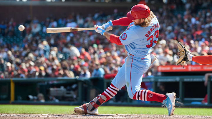 Sep 28, 2024; San Francisco, California, USA; St. Louis Cardinals outfielder Brendan Donovan (33) hits a single against the San Francisco Giants during the fifth inning at Oracle Park. Mandatory Credit: Robert Edwards-Imagn Images