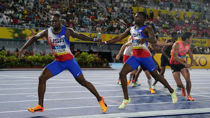 May 4, 2024; Nassau, Bahamas; Champ Allison takes the handoff from Christopher Bailey on the USA 4 x 400m relay during the World Athletics Relays at Thomas A. Robinson National Stadium. Mandatory Credit: Kirby Lee-USA TODAY Sports