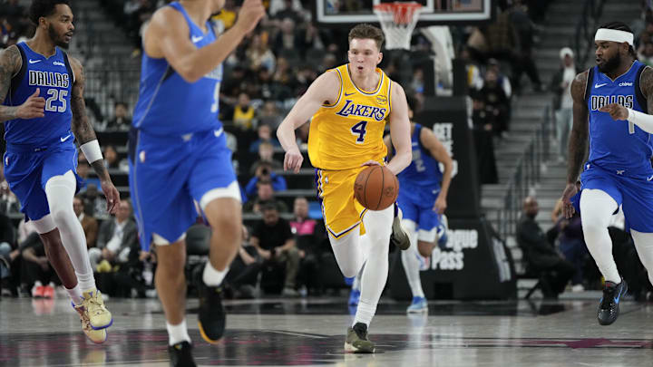 Oct 15, 2025; Las Vegas, Nevada, USA: Los Angeles Lakers wing Dalton Knecht (4) dribbles the ball during the second half against the Dallas Mavericks at T-Mobile Arena. Mandatory Credit: Lucas Peltier-Imagn Images Oct 15, 2025; Las Vegas, Nevada, USA: Los Angeles Lakers wing Dalton Knecht (4) dribbles the ball during the second half against the Dallas Mavericks at T-Mobile Arena. Mandatory Credit: Lucas Peltier-Imagn Images