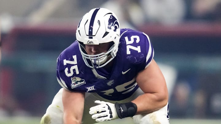 Dec 26, 2024; Phoenix, AZ, USA; Kansas State Wildcats offensive lineman Sam Hecht (75) against the Rutgers Scarlet Knights during the Rate Bowl at Chase Field. Mandatory Credit: Mark J. Rebilas-Imagn Images