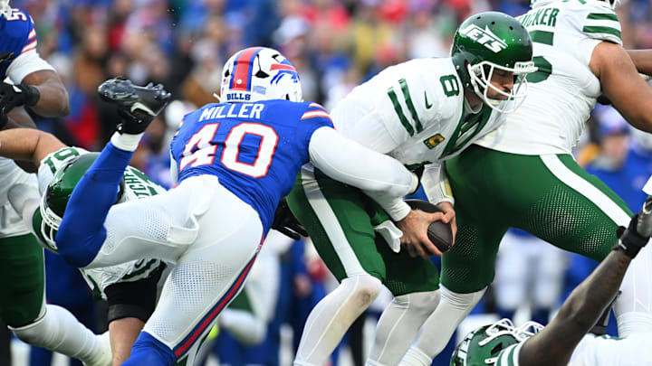 Dec 29, 2024; Orchard Park, New York, USA; New York Jets quarterback Aaron Rodgers (8) is sacked by Buffalo Bills linebacker Von Miller (40) in the third quarter at Highmark Stadium. Mandatory Credit: Mark Konezny-Imagn Images