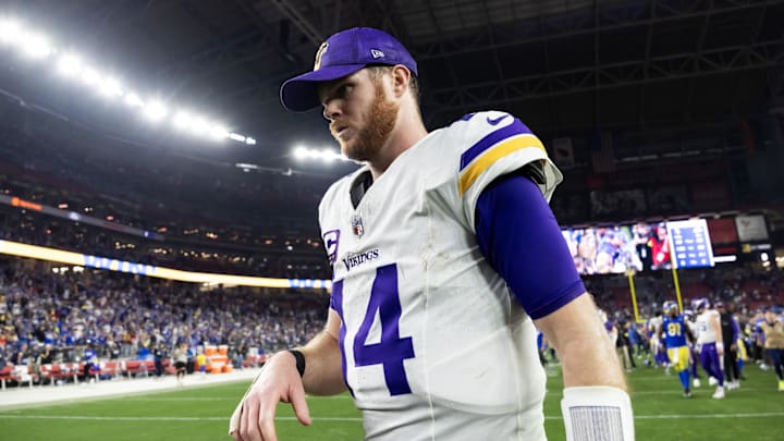 Jan 13, 2025; Glendale, AZ, USA; Minnesota Vikings quarterback Sam Darnold (14) reacts as he walks off the field after losing to the Los Angeles Rams during an NFC wild card game at State Farm Stadium.