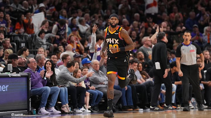 Mar 21, 2025; Phoenix, Arizona, USA; Phoenix Suns forward Royce O'Neale (00) reacts after making a basket against the Cleveland Cavaliers during the first half at Footprint Center. Mandatory Credit: Joe Camporeale-Imagn Images